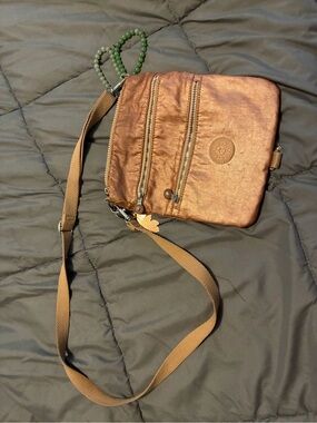 Metallic Kipling Crossbody Bag with Adjustable Strap